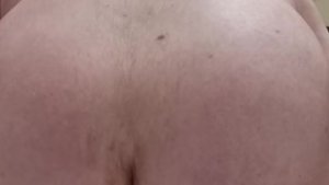 white kiwi bear from NZ puts a cucumber in his ass.